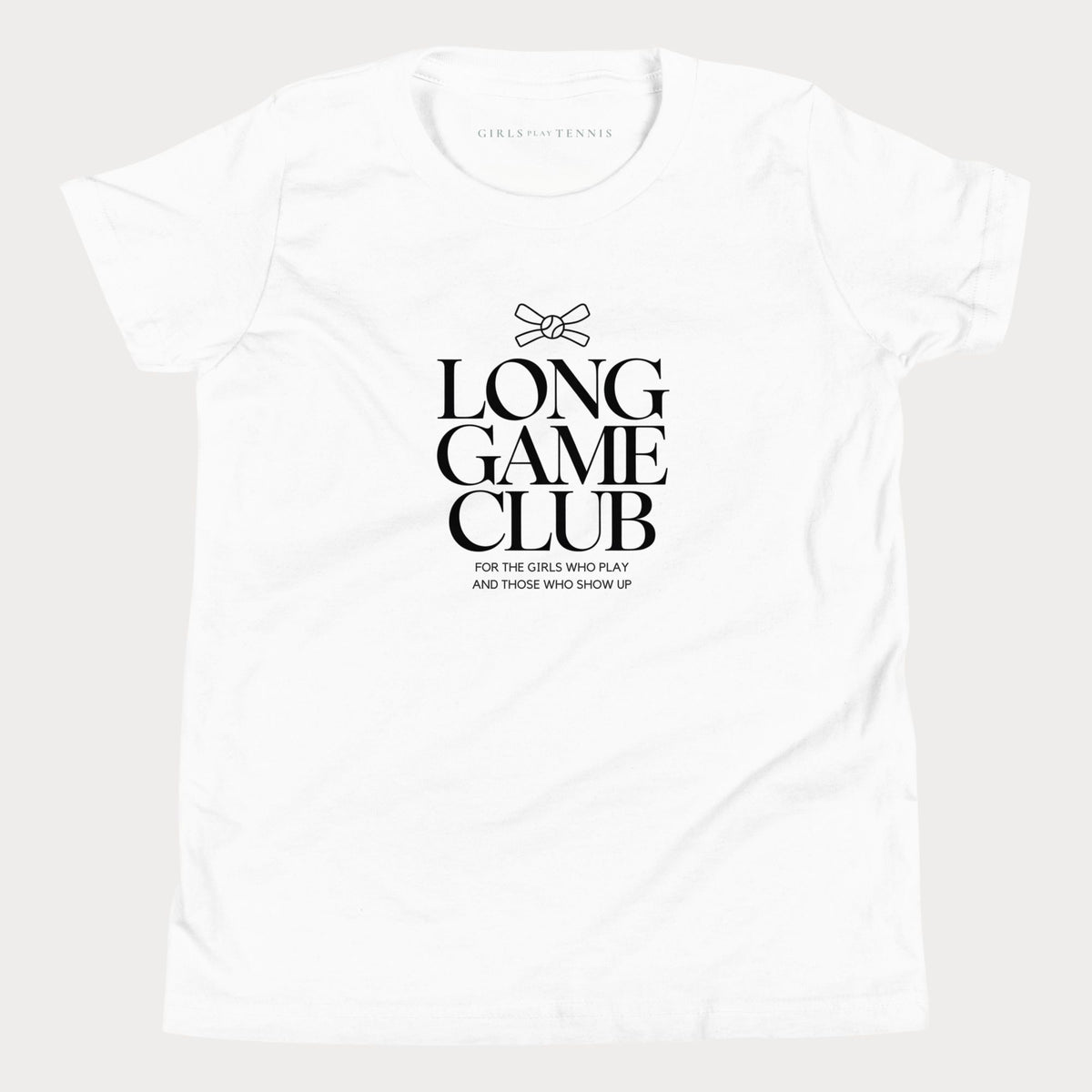 White Long Game Club girls' tennis T-shirt with stacked lettering and a small bow