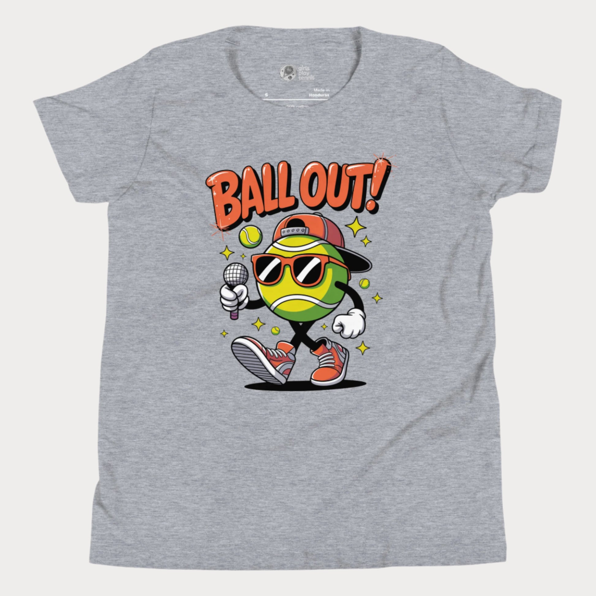 Grey girls tennis t-shirt with "Ball Out!" slogan and cartoon tennis ball character in shades and sneakers holding a mic