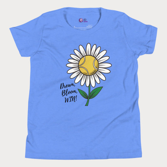 Cute blue girls' tennis t-shirt featuring a daisy with a tennis ball center and the motivational slogan "Dream, Bloom, WIN!" 