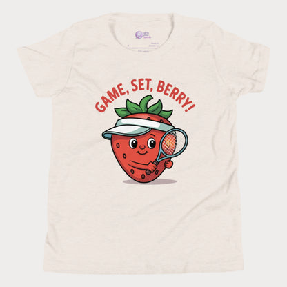 Beige girls tennis t-shirt with a smiling strawberry wearing a visor and holding a tennis racket, with the phrase ‘Game, Set, Berry!’ above it.