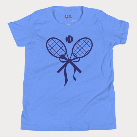 Cute girls' tennis t-shirt in blue featuring a stylish design of two crossed tennis rackets tied with a bow and a tennis ball above.