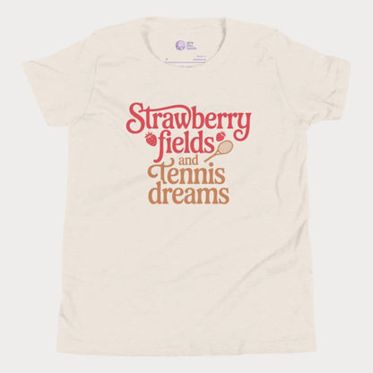 Beige girls tennis t-shirt with retro text that reads ‘Strawberry fields and tennis dreams’ with tennis and strawberry icons.
