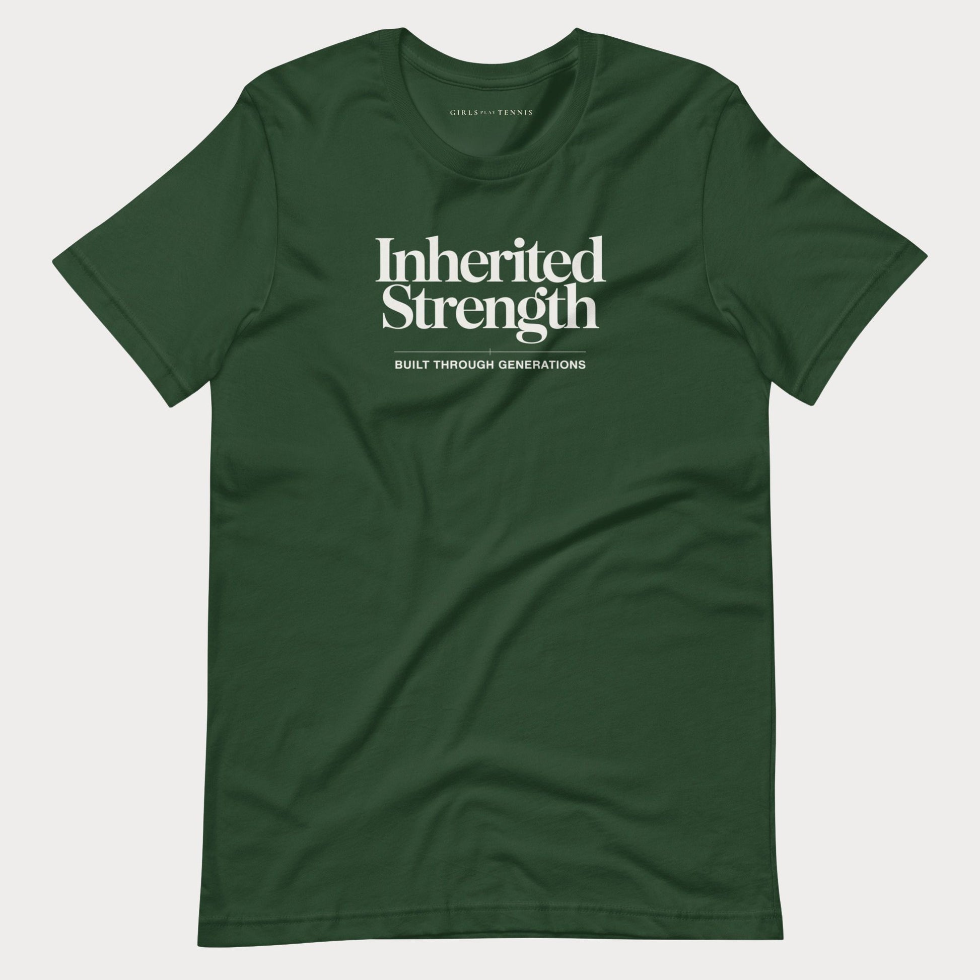 A dark green crewneck women's tennis t-shirt with white text reading 'Inherited Strength' and 'BUILT THROUGH GENERATIONS' on the chest, displayed flat against a light gray background.