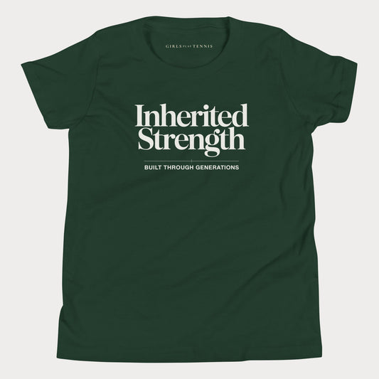 A dark green short-sleeve t-shirt with 'Inherited Strength' printed in white serif text on the chest, with 'BUILT THROUGH GENERATIONS' underneath. The brand 'GIRLS PLAY TENNIS' is printed inside the collar.