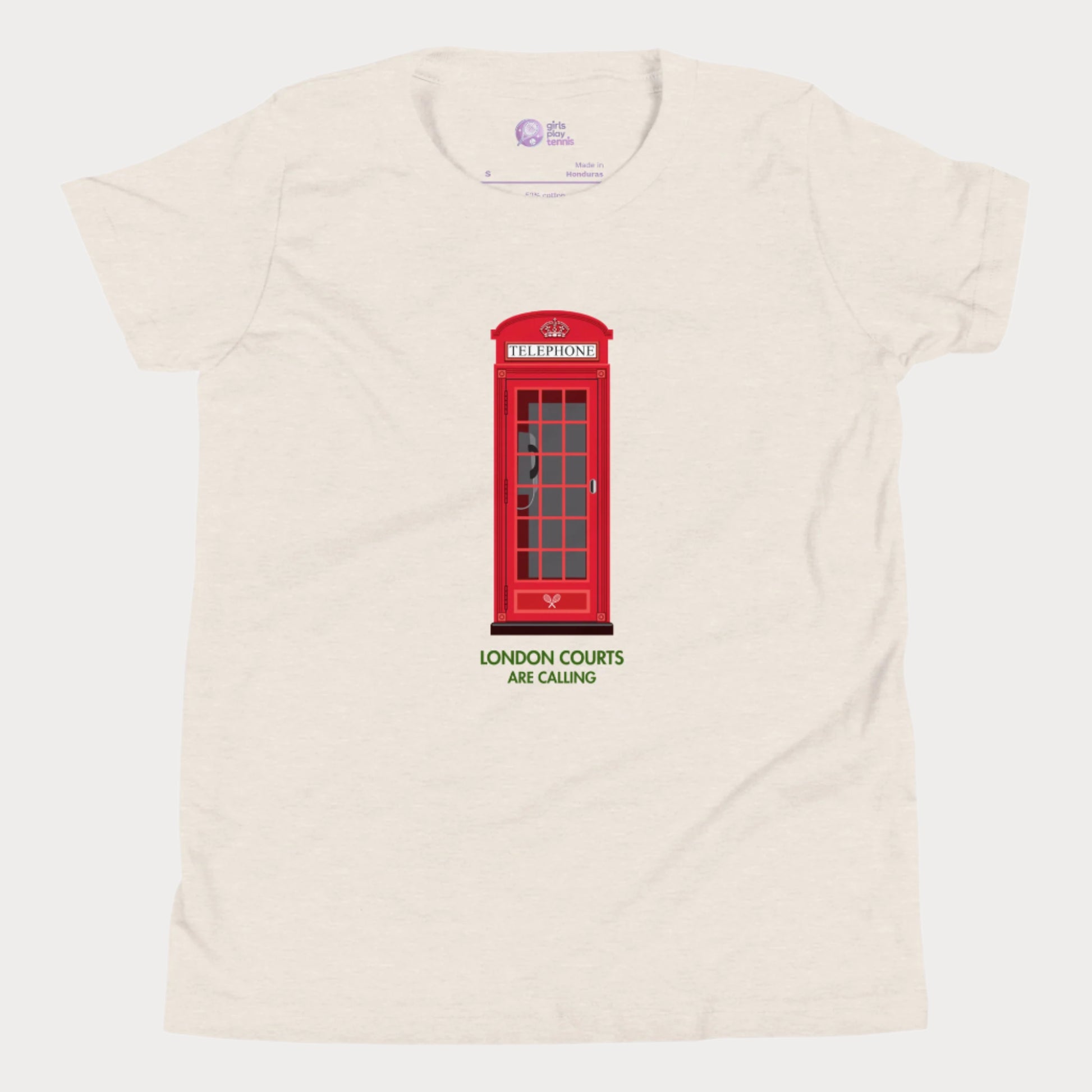 Beige girls’ tennis T-shirt with red London phone booth and green grass court text