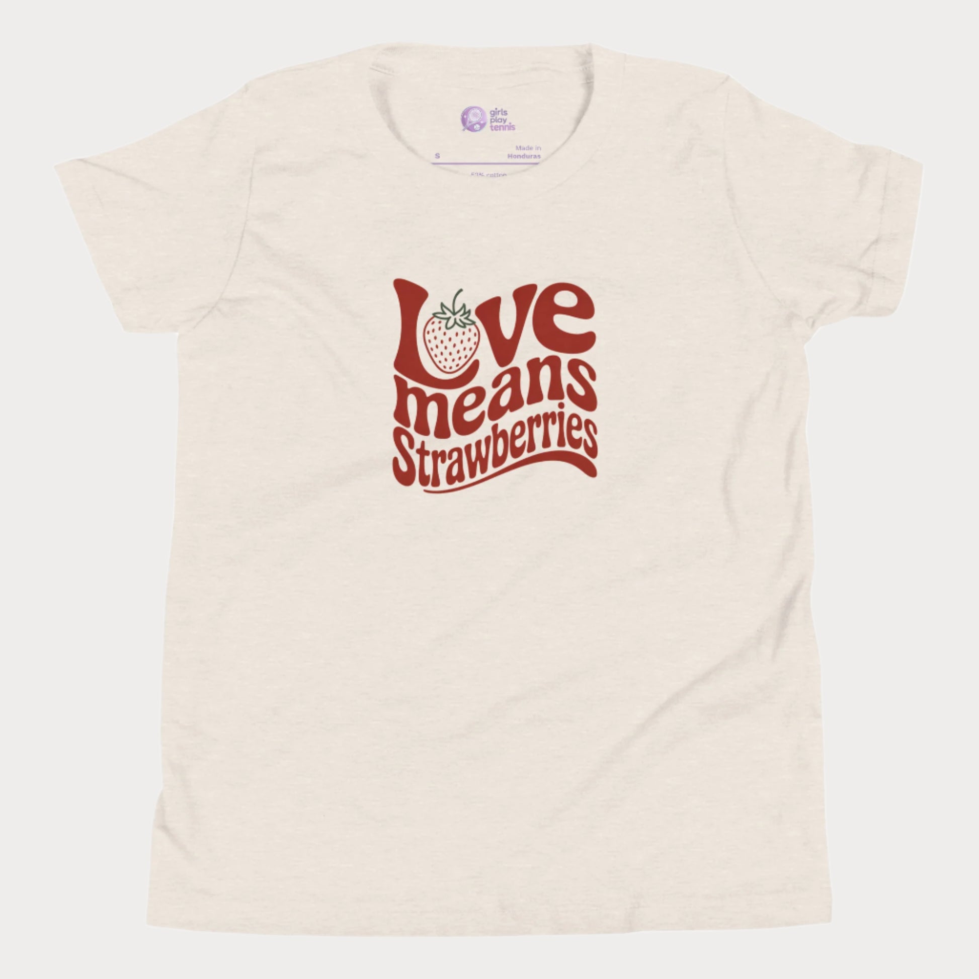 Beige girls’ tennis T-shirt with retro red “Love Means Strawberries” slogan and cute illustrated strawberry