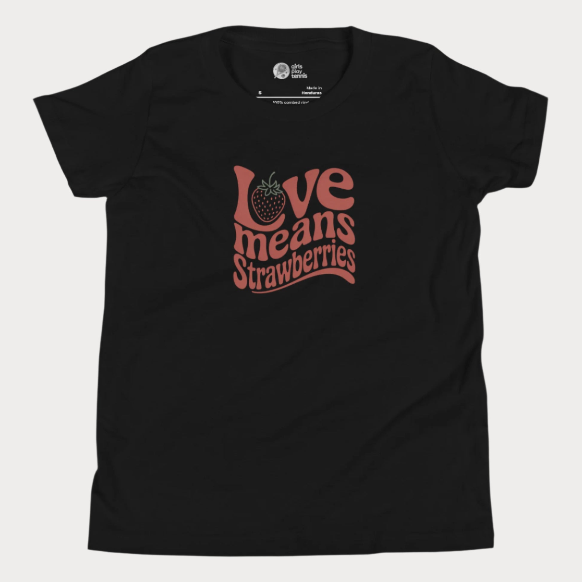 Black girls’ tennis T-shirt with retro red “Love Means Strawberries” slogan and cute illustrated strawberry. 