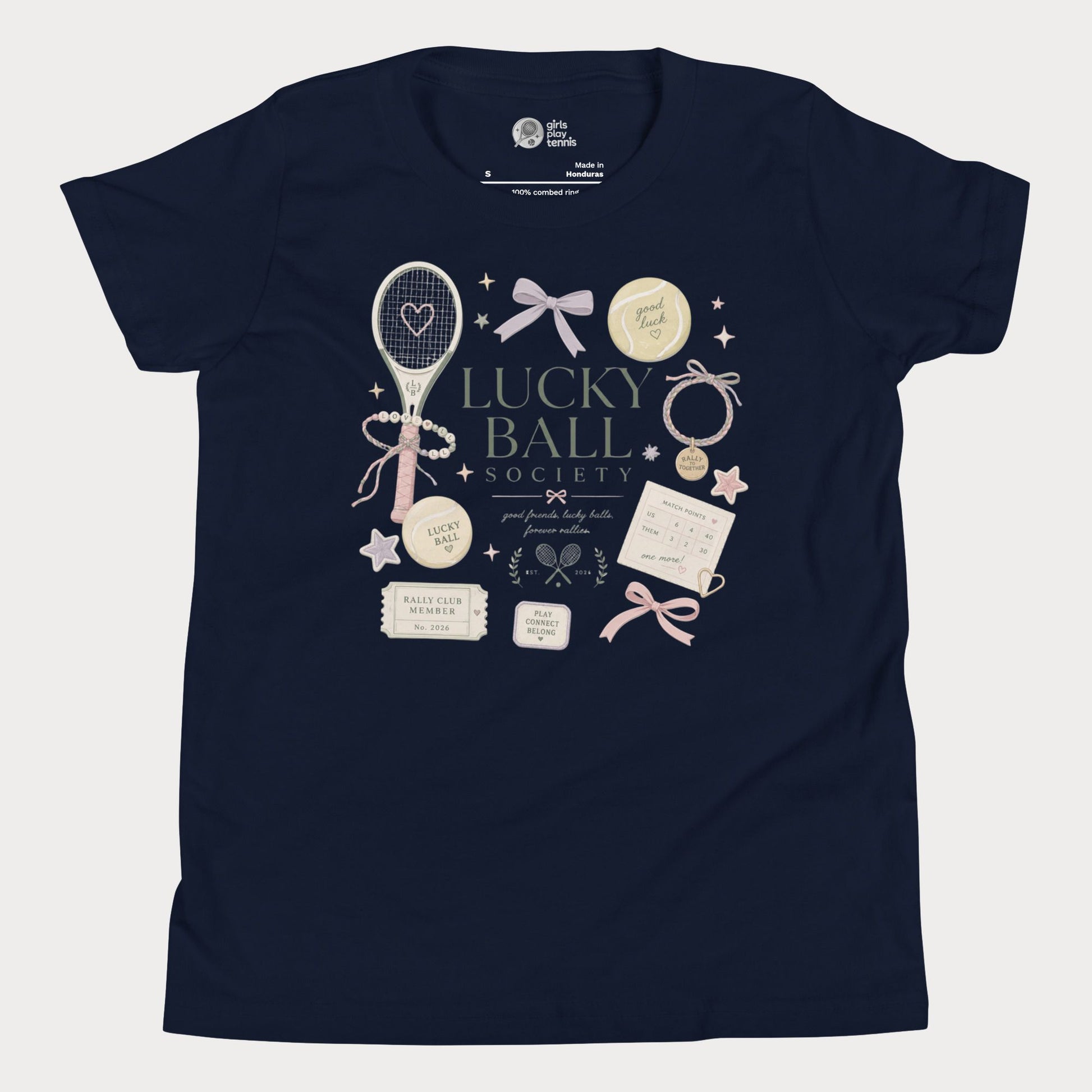 Navy girls tennis tee featuring lucky ball society artwork with bows, bracelets, and vintage tennis lifestyle details