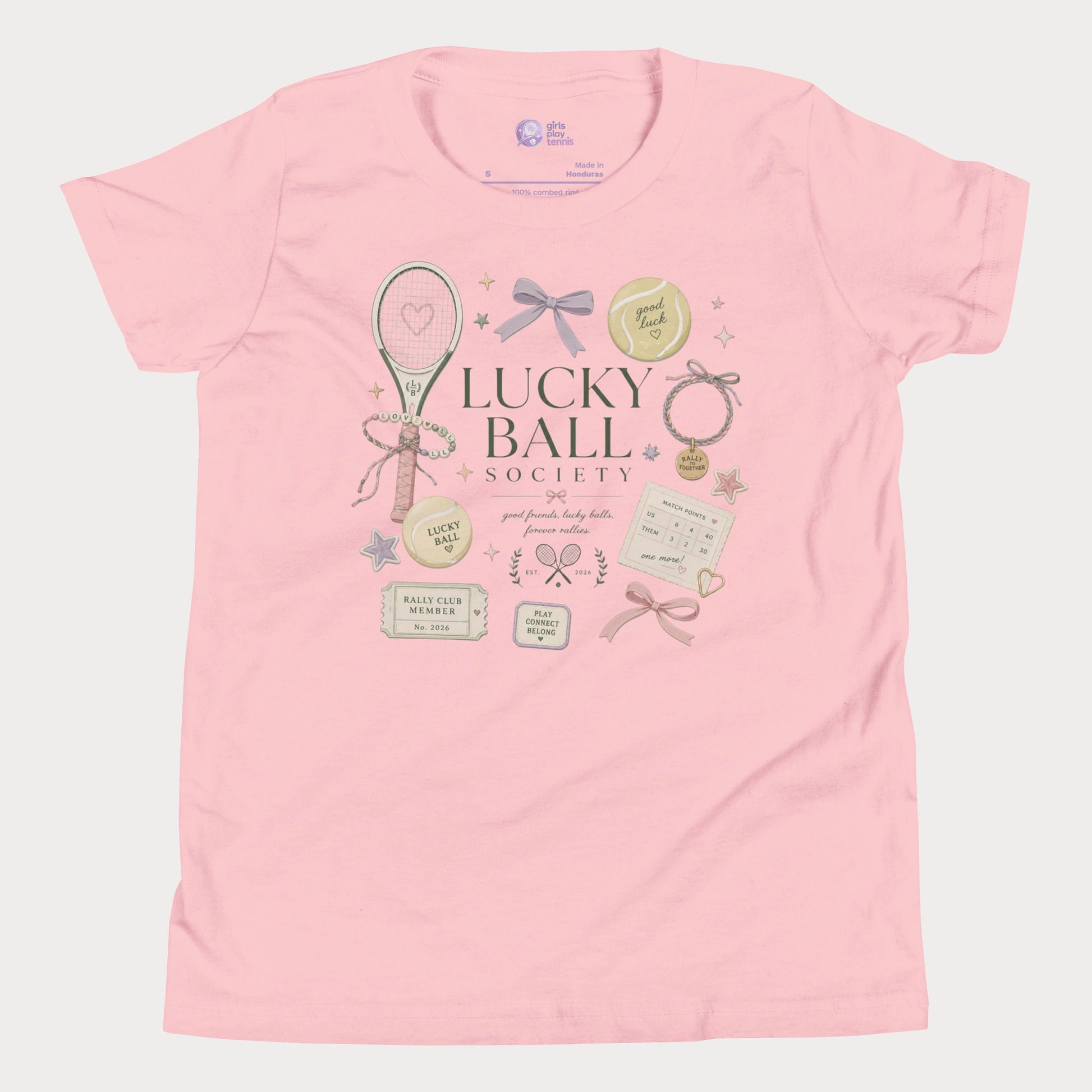 Pink girls tennis tee featuring lucky ball society artwork with bows, bracelets, and vintage tennis lifestyle details
