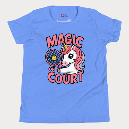Blue girls' tennis t-shirt featuring a cute unicorn holding a racket with a tennis ball, alongside bold 'Magic on Court' text. Fun and empowering tennis apparel for young girls who love tennis and playful designs.