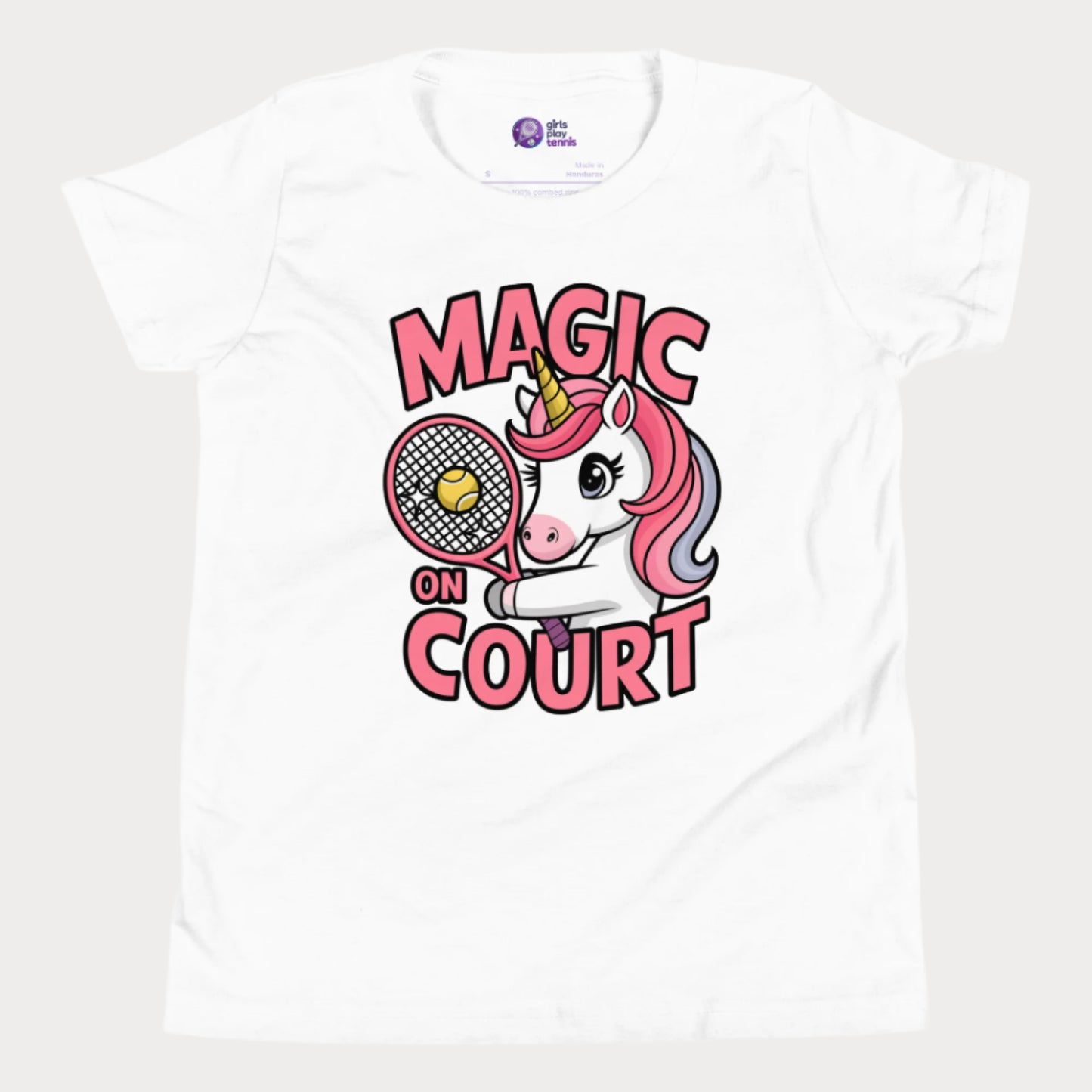 White girls' tennis t-shirt featuring a cute unicorn holding a racket with a tennis ball, alongside bold 'Magic on Court' text. Fun and empowering tennis apparel for young girls who love tennis and playful designs.