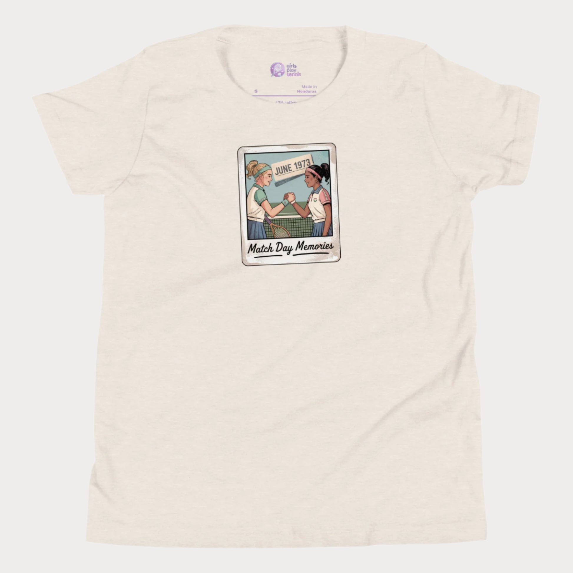 Polaroid-style illustration of two girls shaking hands on a tennis court with ‘June 1973’ and text reading Match Day Memories on a girls tennis t-shirt