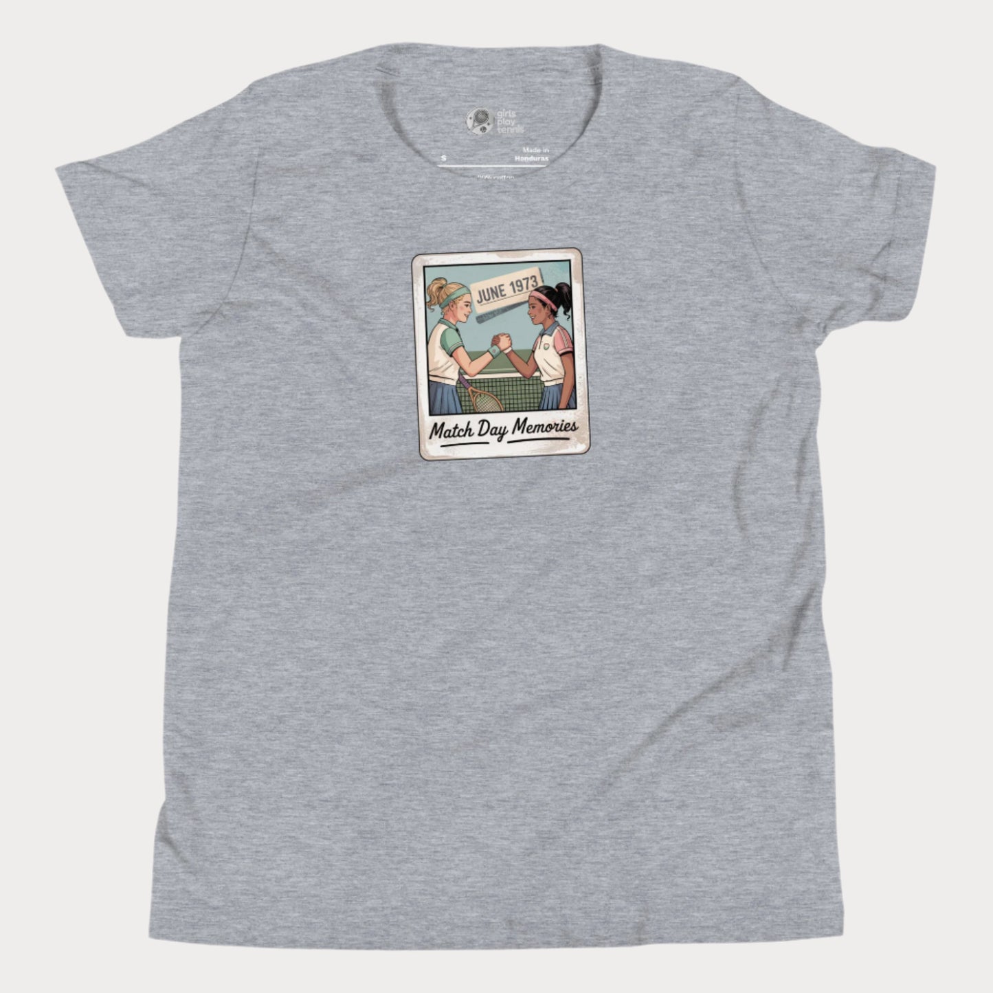 Polaroid-style illustration of two girls shaking hands on a tennis court with ‘June 1973’ and text reading Match Day Memories on a girls tennis t-shirt