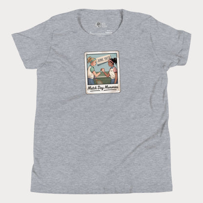 Polaroid-style illustration of two girls shaking hands on a tennis court with ‘June 1973’ and text reading Match Day Memories on a girls tennis t-shirt