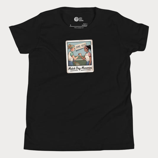 Polaroid-style illustration of two girls shaking hands on a tennis court with ‘June 1973’ and text reading Match Day Memories on a girls tennis t-shirt
