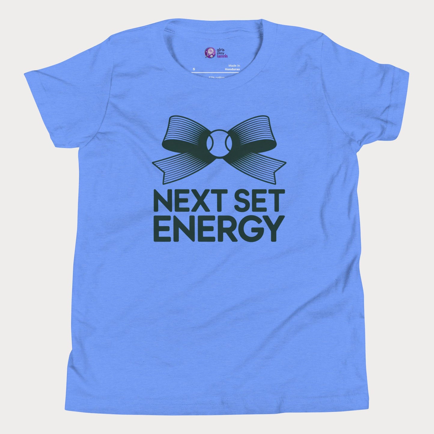 Next Set Energy tennis tee in blue with green bow and bold typography design for girls and women
