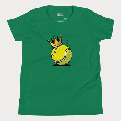 A green girls’ tennis t-shirt featuring a bold yellow tennis ball with a golden crown perched on top. This playful design celebrates young girls who rule the court with power and personality.