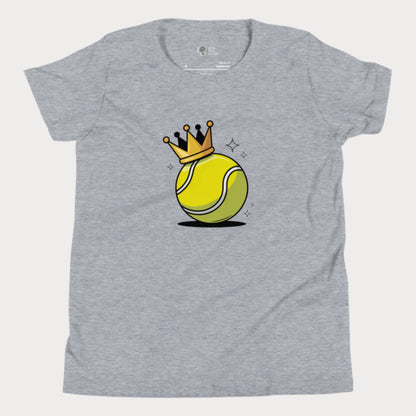 A heather grey girls’ tennis t-shirt featuring a bold yellow tennis ball with a golden crown perched on top. This playful design celebrates young girls who rule the court with power and personality.