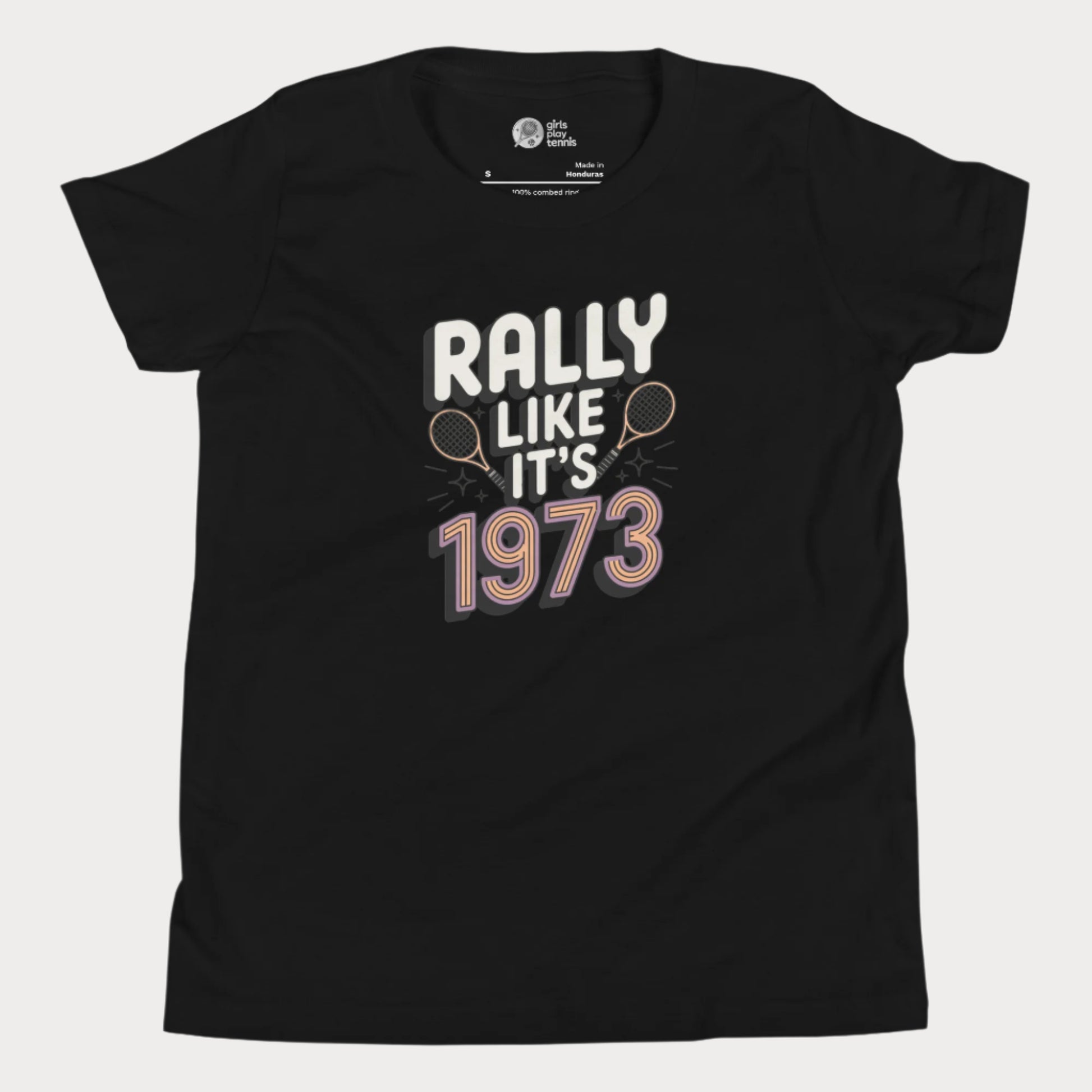 Black girls tennis t-shirt with retro slogan ‘Rally Like It’s 1973’ and crossed tennis rackets