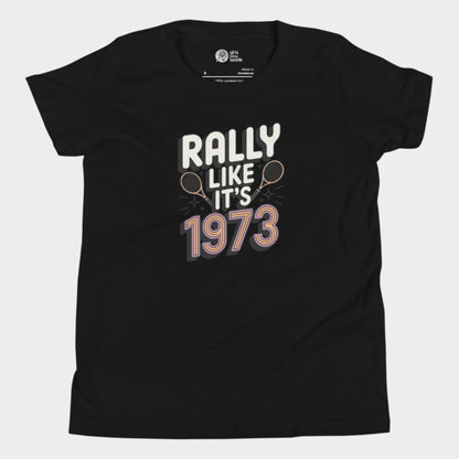 Black girls tennis t-shirt with retro slogan ‘Rally Like It’s 1973’ and crossed tennis rackets