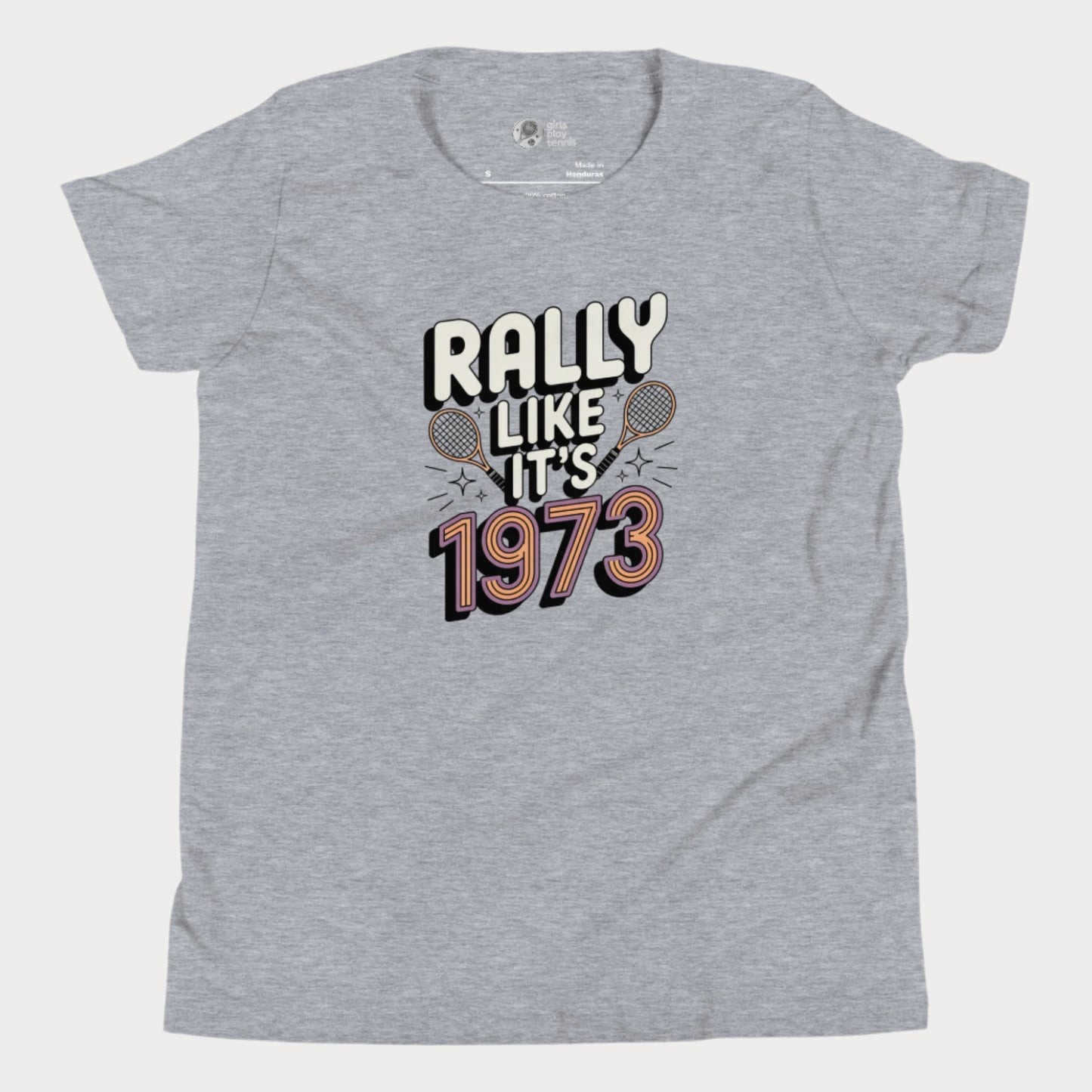 Grey girls tennis t-shirt with retro slogan ‘Rally Like It’s 1973’ and crossed tennis rackets