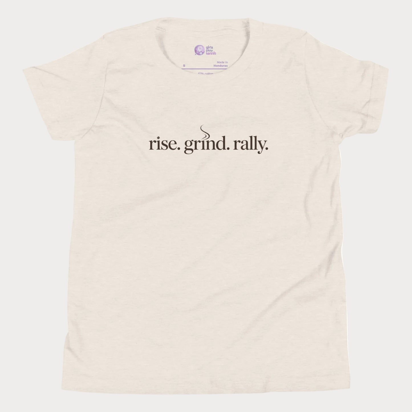 Beige tennis t-shirt with Rise Grind Rally slogan across the chest – Girls Play Tennis apparel.