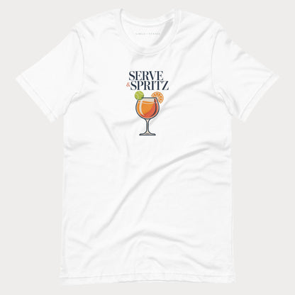A white-colored short-sleeve tennis lifestyle t-shirt with a graphic on the chest that reads 'SERVE & SPRITZ' above an illustration of a cocktail with a tennis ball and orange slice.