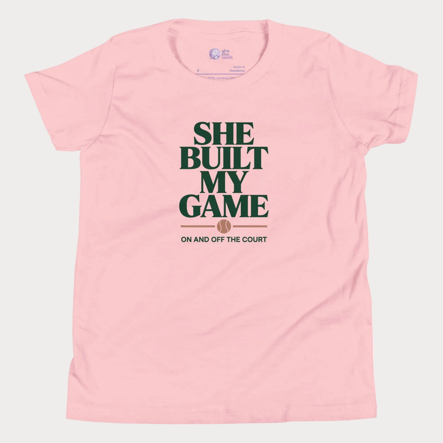 She Built My Game tennis t-shirt in pink with white typography and tennis graphic for girls and women