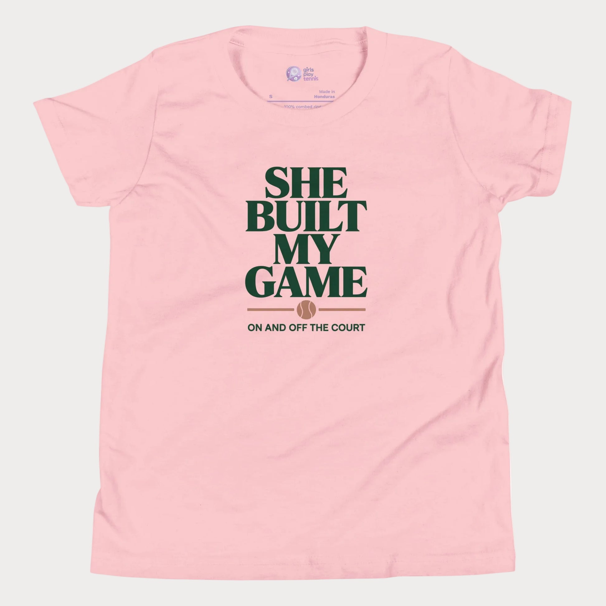 She Built My Game tennis t-shirt in pink with white typography and tennis graphic for girls and women