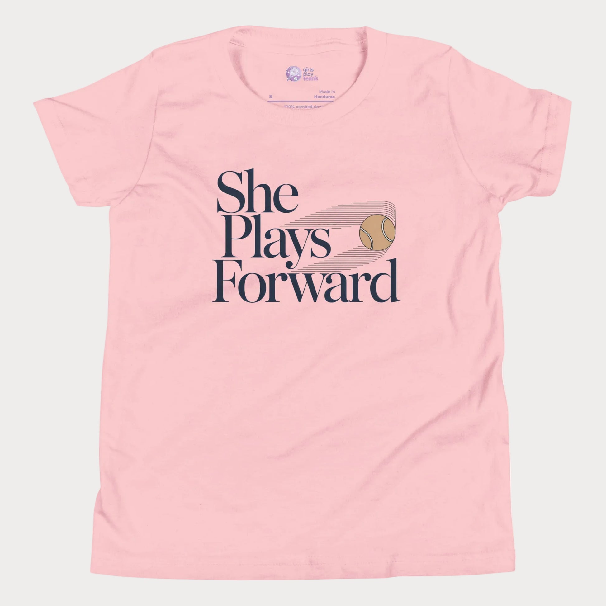 She Plays Forward tennis t-shirt in pink with typography and tennis ball graphic for girls and women