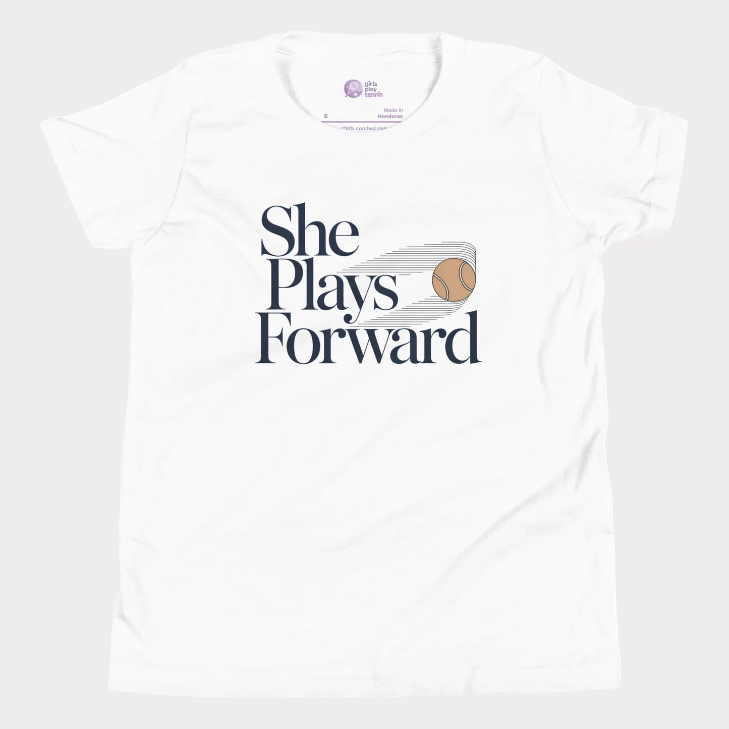 She Plays Forward tennis t-shirt in white with typography and tennis ball graphic for girls and women