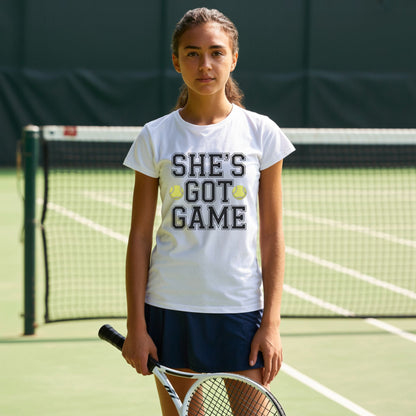 Teenage girls wearing a white t-shirt with empowering slogan “She’s Got Game” and tennis ball accents.