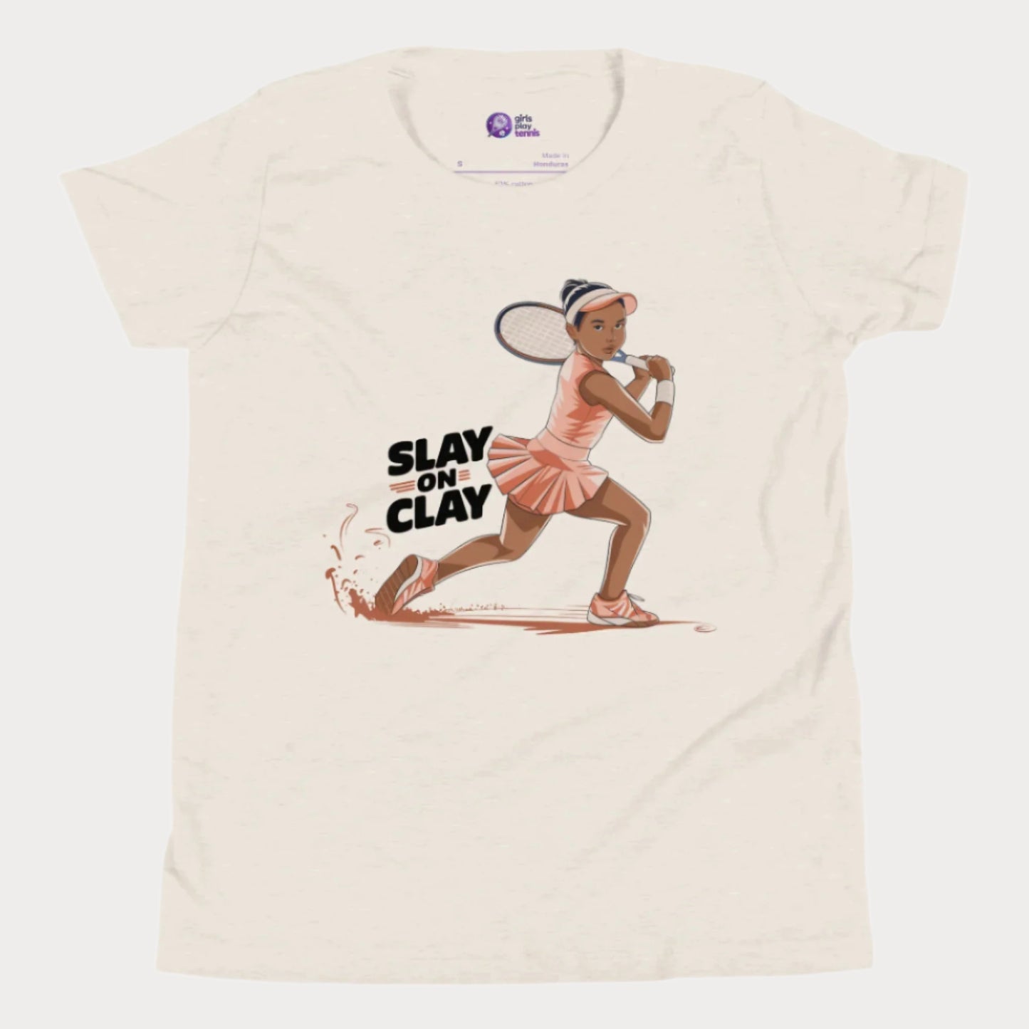 Beige heather tennis T-shirt featuring an illustrated young girl in a fierce backhand stance, sliding on a clay court with the phrase "Slay on Clay."