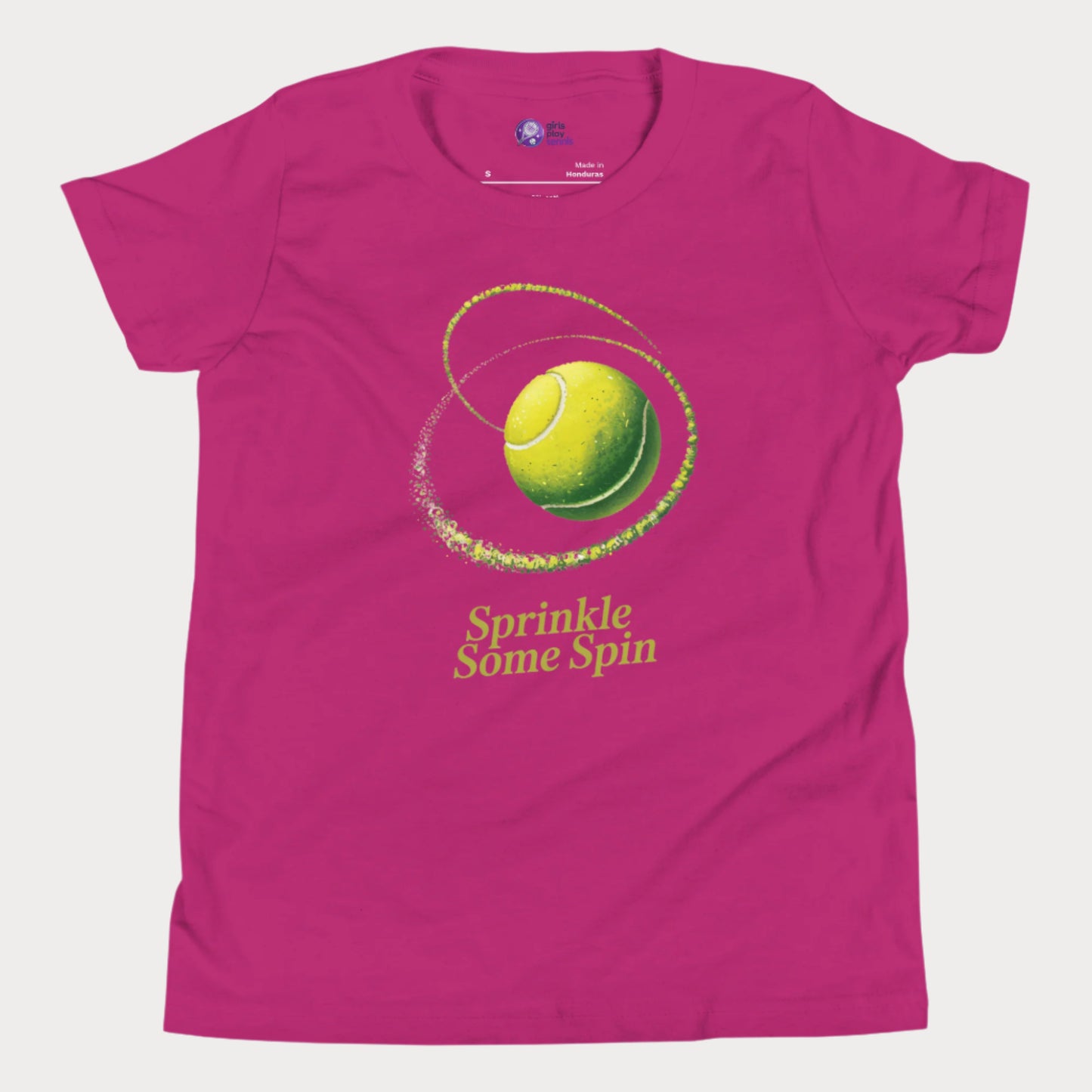Berry girls tennis t-shirt with a spinning yellow tennis ball and the phrase “Sprinkle Some Spin” in bold yellow text.