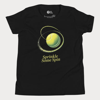 Black girls tennis t-shirt with a spinning yellow tennis ball and the phrase “Sprinkle Some Spin” in bold yellow text