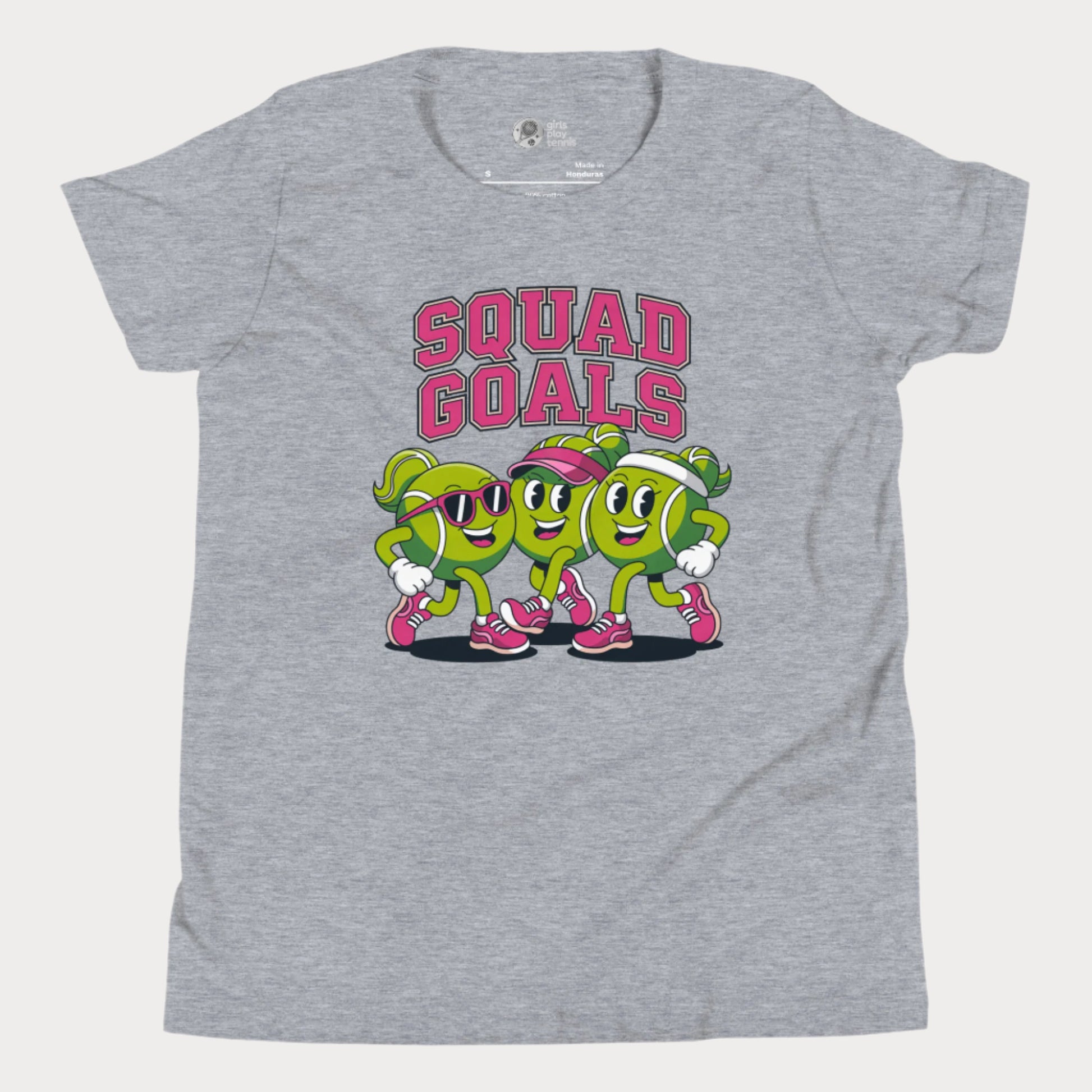 Cartoon tennis ball characters on a girls t-shirt with the phrase "Squad Goals"