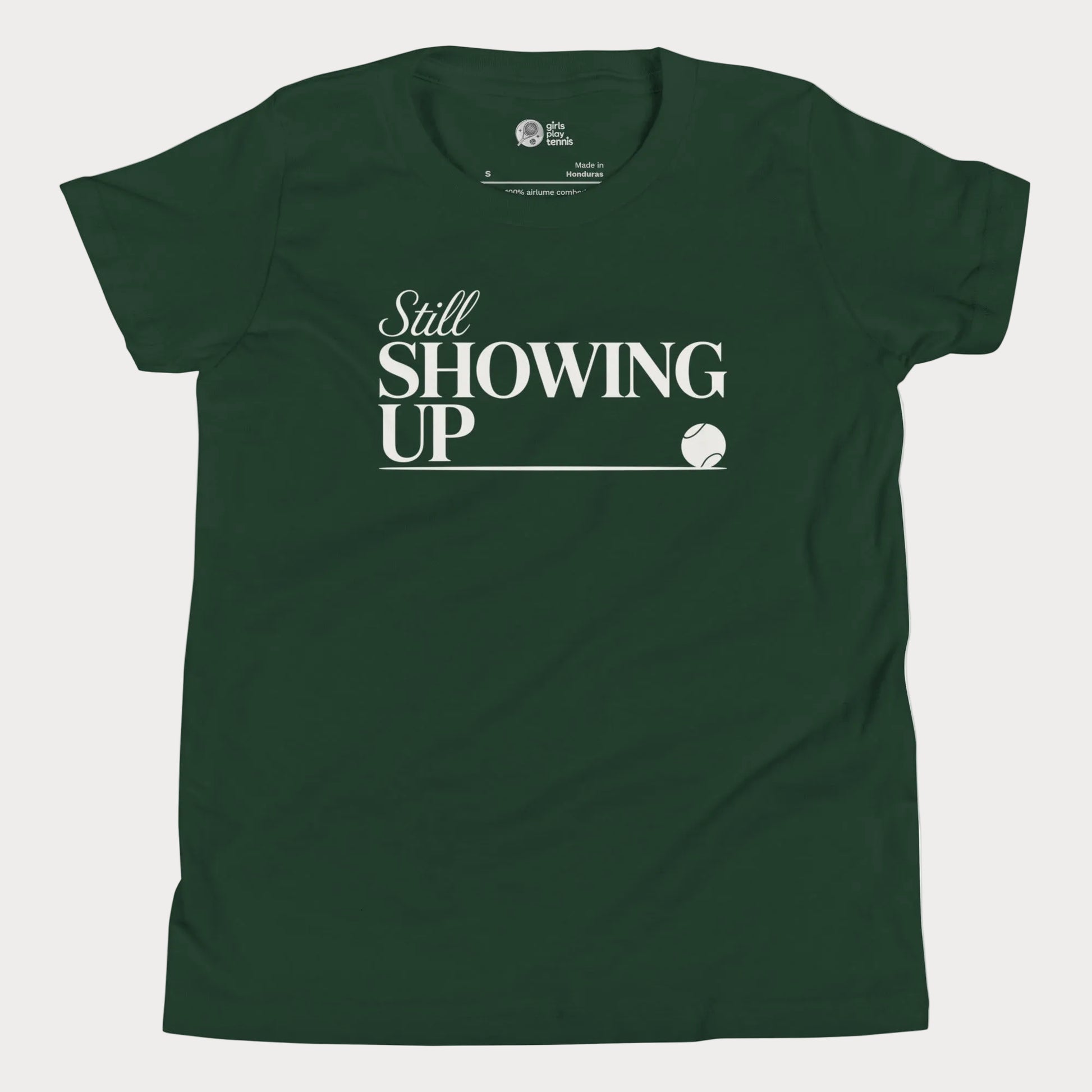 Still Showing Up tennis t-shirt in forest green with white typography and tennis graphic for girls and women