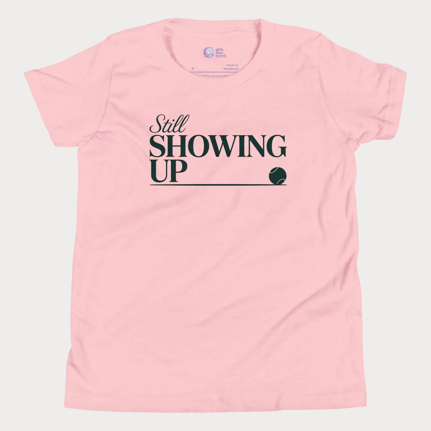Still Showing Up tennis t-shirt in pink with white typography and tennis graphic for girls and women