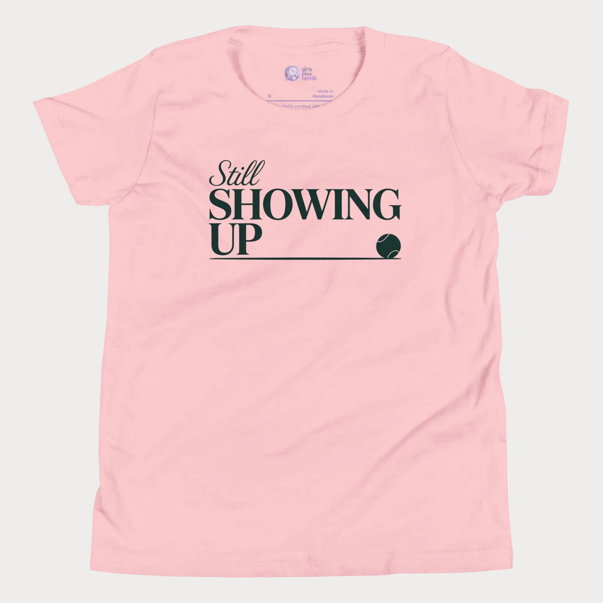 Still Showing Up tennis t-shirt in pink with white typography and tennis graphic for girls and women