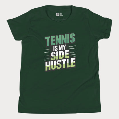 Girls tennis t-shirt with 'Tennis Is My Side Hustle' slogan, celebrating hustle and grit during hard court season.