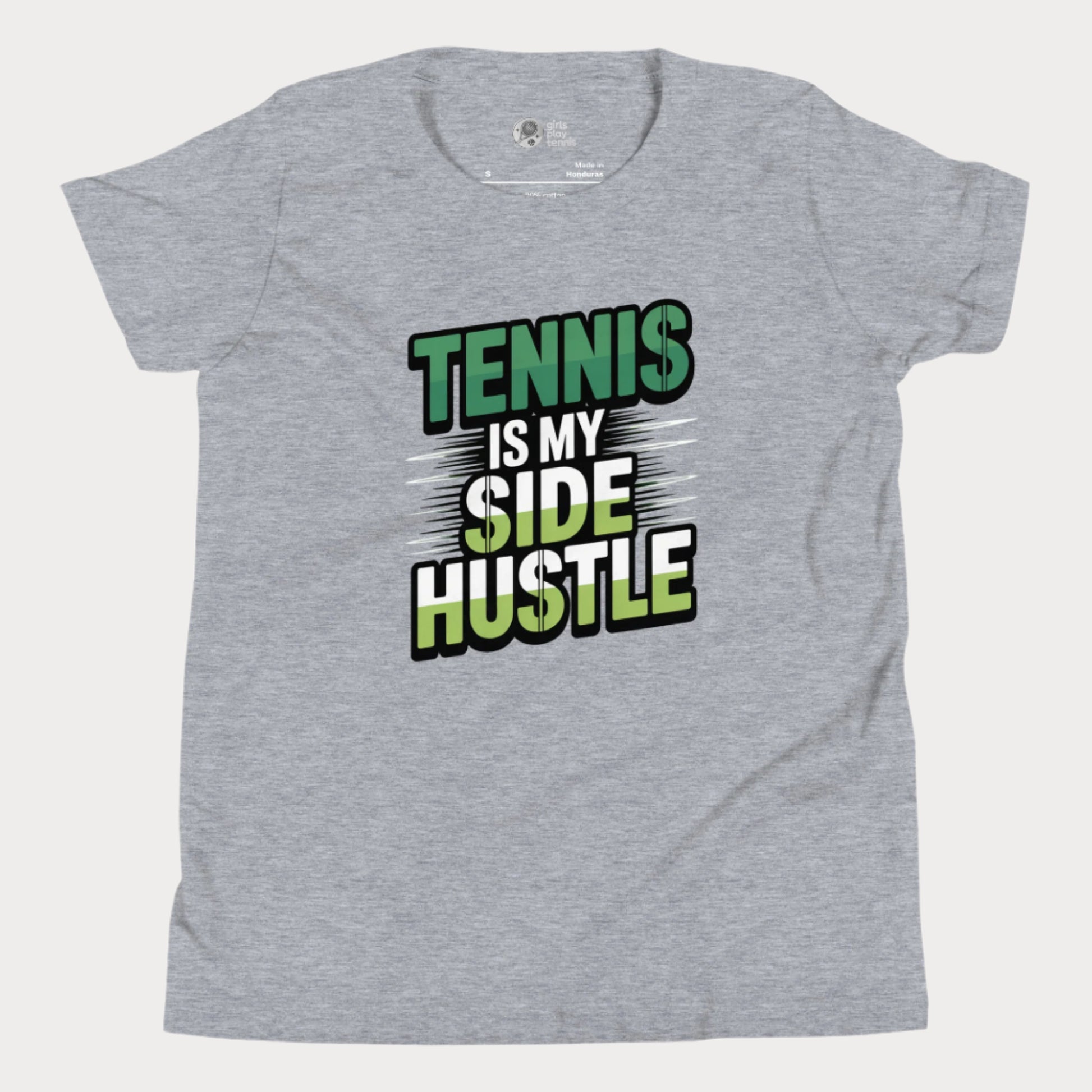 Girls tennis t-shirt with 'Tennis Is My Side Hustle' slogan, celebrating hustle and grit during hard court season.