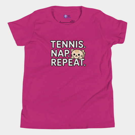 Berry kids tennis t-shirt with “Tennis. Nap. Repeat.” text and a cute cartoon cat illustration, part of the Girls Play Tennis apparel line.