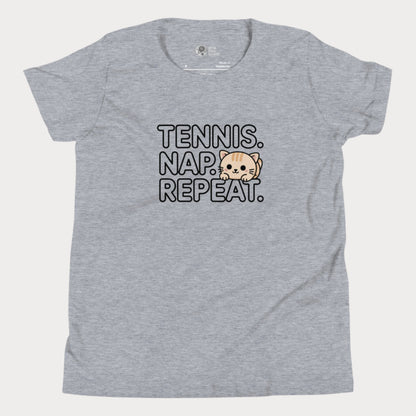 Grey kids tennis t-shirt with “Tennis. Nap. Repeat.” text and a cute cartoon cat illustration, part of the Girls Play Tennis apparel line.