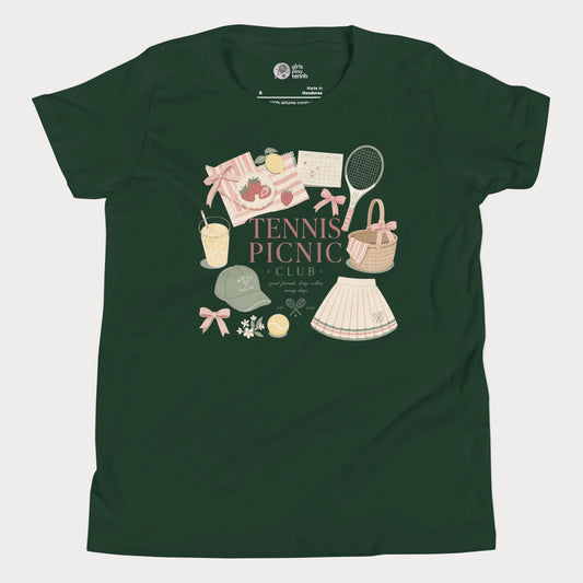 Girls tennis tee featuring picnic-inspired tennis lifestyle artwork with strawberries, lemonade, bows, and pleated skirt details