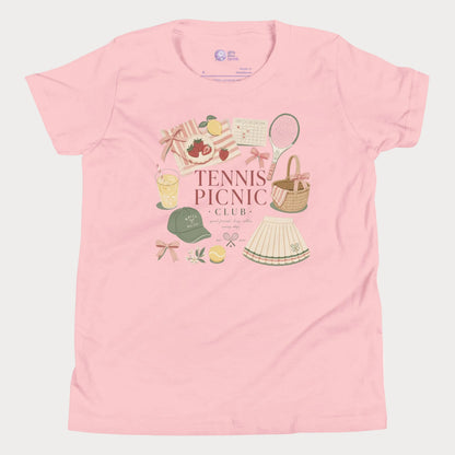 Girls tennis tee featuring picnic-inspired tennis lifestyle artwork with strawberries, lemonade, bows, and pleated skirt details