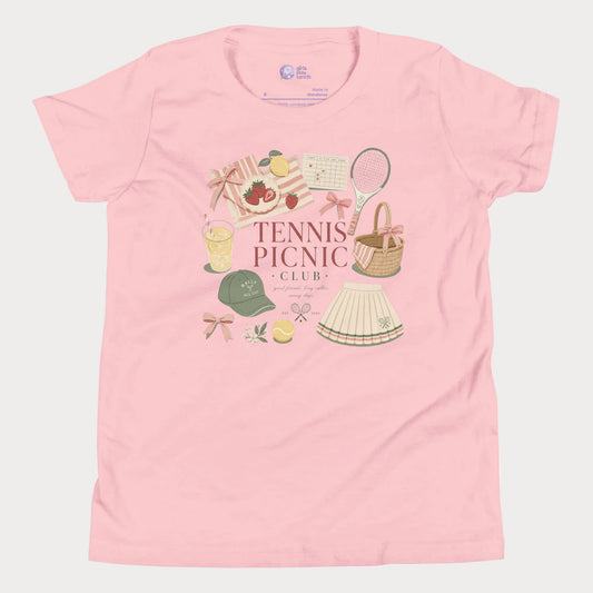 Girls tennis tee featuring picnic-inspired tennis lifestyle artwork with strawberries, lemonade, bows, and pleated skirt details