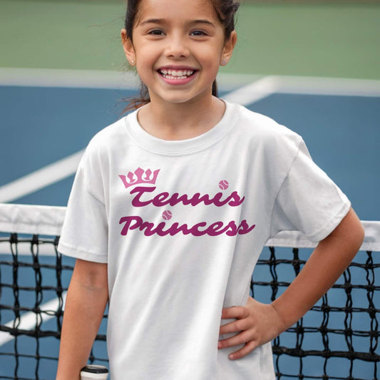Young girl wearing an adorable "Tennis Princess" girls' t-shirt that blends sporty confidence with a touch of royalty.