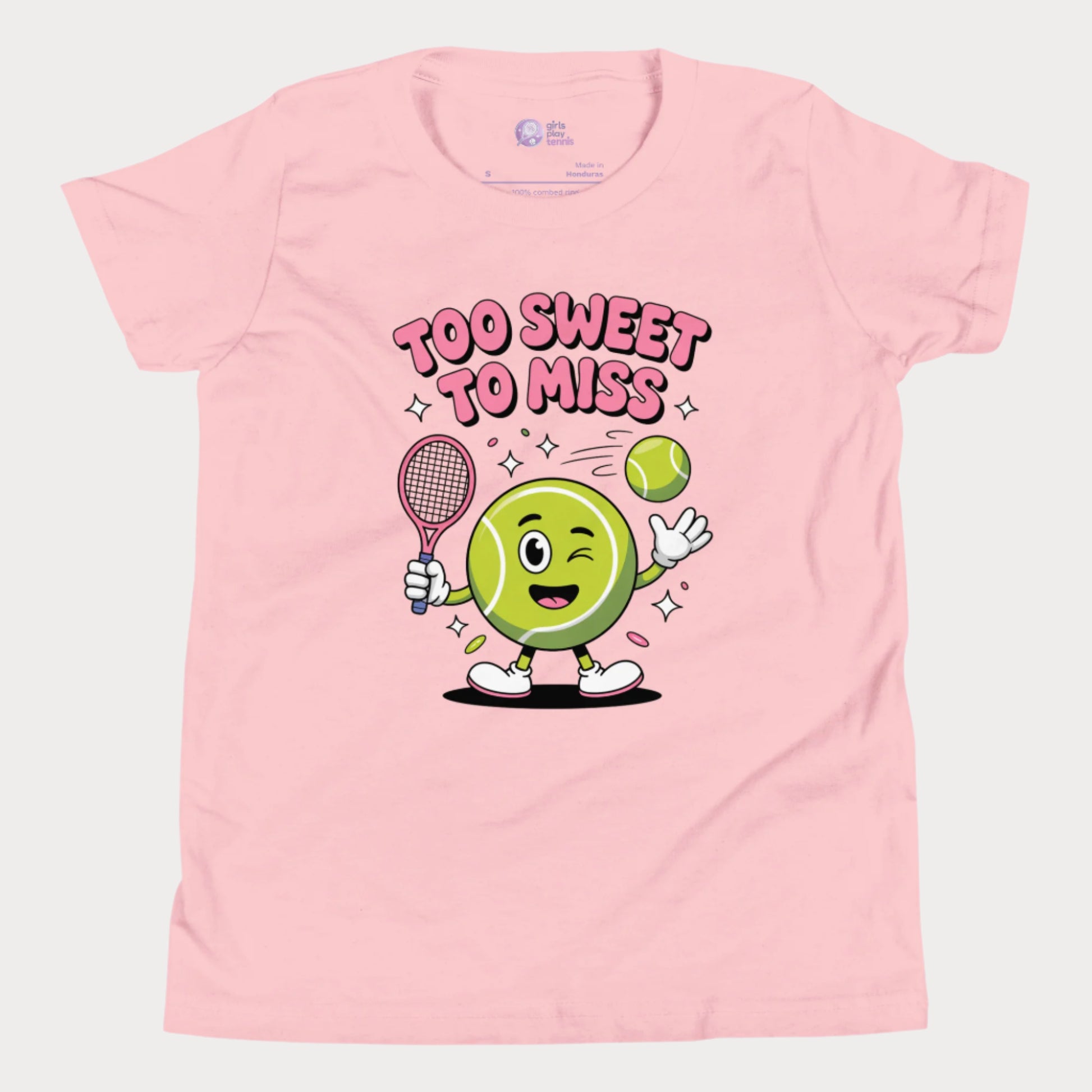 Pink girls tennis t-shirt with a winking cartoon tennis ball holding a racket and the slogan “Too Sweet To Miss” in bold letters.