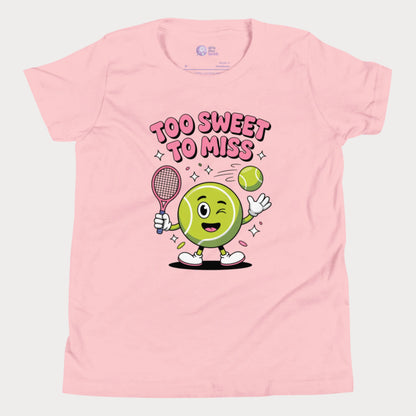 Pink girls tennis t-shirt with a winking cartoon tennis ball holding a racket and the slogan “Too Sweet To Miss” in bold letters.