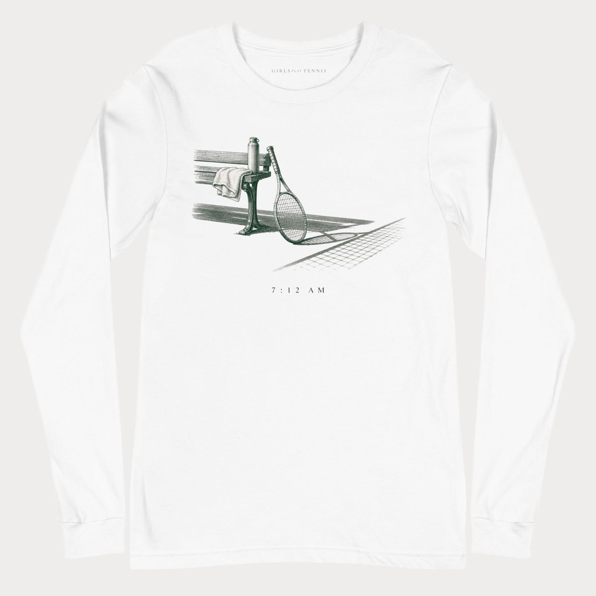 White 7:12 AM women's tennis long-sleeve T-shirt with an illustration of a racket leaning against a courtside bench beside a net